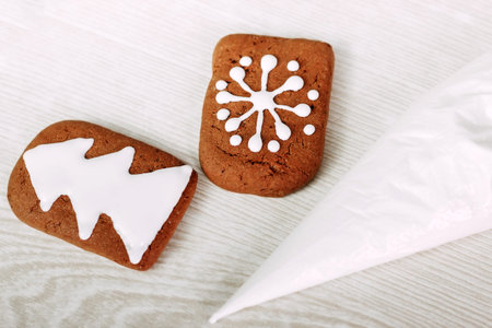 Christmas gingerbread cookies painted with icing sugar.の写真素材