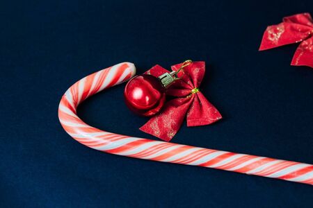 Christmas decorations, christmas ball and candy on a dark backgroundの写真素材