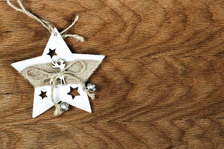 wooden christmas tree toys on wooden background. space for text, background for designersの写真素材