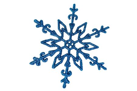 Blue christmas snowflake isolated on spruce background. Brilliant holiday starの写真素材