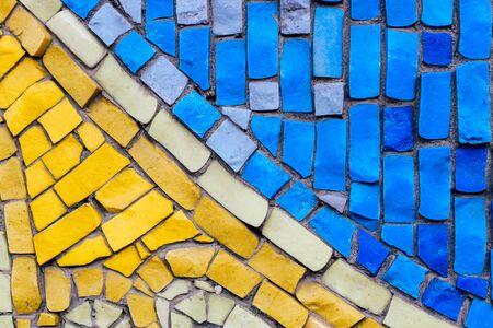 texture of multi-colored stones. Background from vintage mosaic on the wall.の写真素材