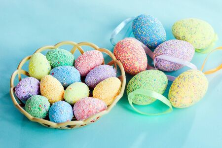 Multi-colored Easter eggs in a basket. Spring decor.の写真素材