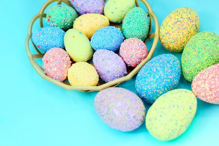 Multi-colored Easter eggs in a basket. Spring decor.の写真素材