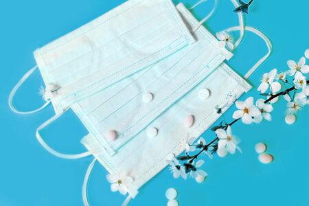 Spring flowers with medical protective mask, allergy concept.の写真素材