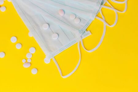 Pills and vitamins on a protective medical bandage. Influenza virus.の写真素材