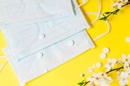 Spring flowers with medical protective mask, allergy concept.の写真素材