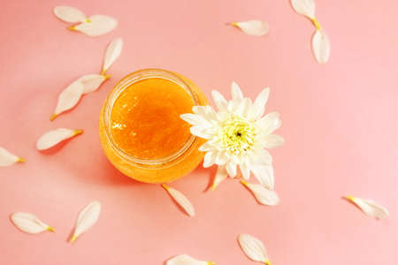 Chrysanthemum and petals with a natural body and face scrub. Space for text.の写真素材