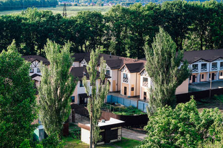 Private residential townhouses. Modern housing in the countryside in green foliage. Ideal family plot.の写真素材