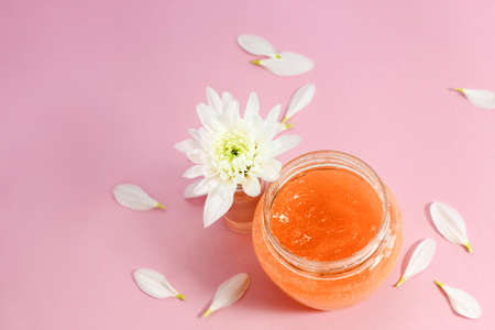 Chrysanthemum and petals with a natural body and face scrub. Space for text.の写真素材