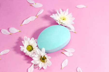 Chrysanthemum and petals with natural body and face soap. Space for text.の写真素材