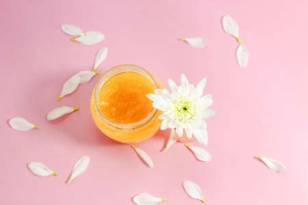 Chrysanthemum and petals with a natural body and face scrub. Space for text.の写真素材