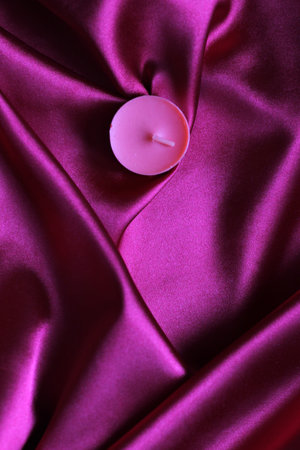 Romantic aroma candles on a silk background. Valentines day background.の写真素材