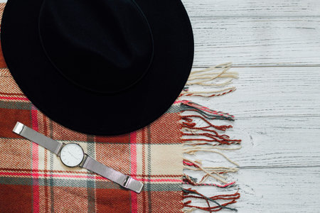 Flatley with black hat and autumn plaid scarf and watch.の写真素材