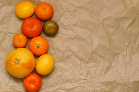 Different citrus on a background of kraft paper. Eco products conceptの写真素材