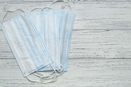 Medical masks on a background of white boards. Copyspace.の写真素材
