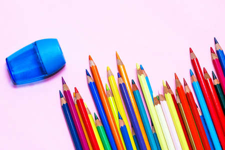Multi-colored professional pencils with a sharpener.の写真素材