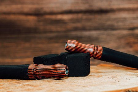 Coconut embers on a wooden background with beautiful handmade mouthpieces.の写真素材
