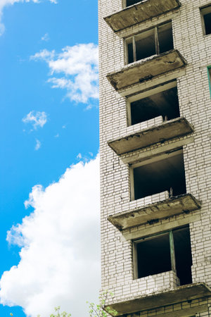 Abandoned empty city, multi-storey building. Empty rooms without windows.