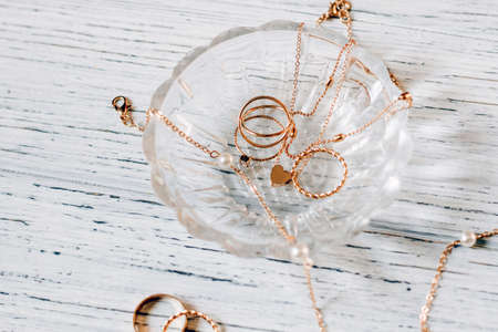 gold jewelry lie on a crystal stand.の写真素材