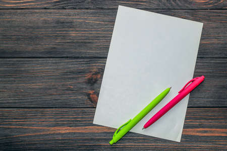 School creative flatley. Colored pens with empty space for text lie on a wooden table.の写真素材