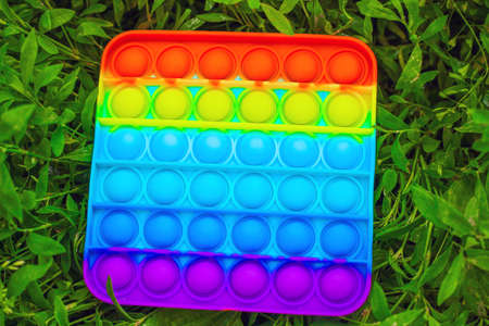 Square multicolor bubble toy antistress sensory push toy.の写真素材