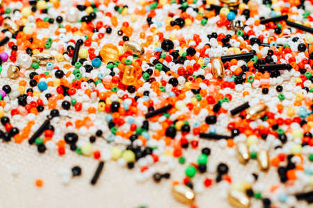 Multicolored orange, white, black beads close up.の写真素材