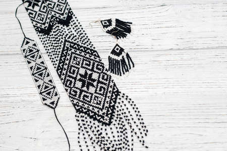 Ethnic decoration gerdan, viconane z biseru, ukrainian gerdan and earrings. hand weaving, geometric pattern.の写真素材
