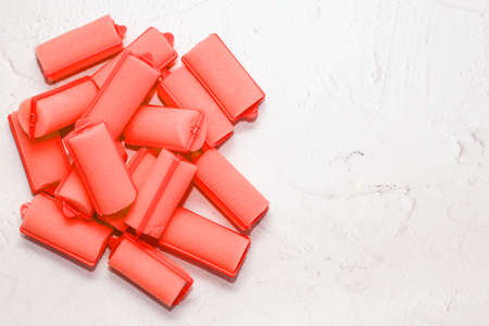 Soft foam comfortable hair curlers on a solid background.の写真素材