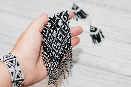 Ethnic decoration gerdan, viconane z biseru, ukrainian gerdan and earrings. hand weaving, geometric pattern.の写真素材
