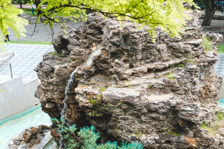 home pond with artificial waterfall and stones.の写真素材
