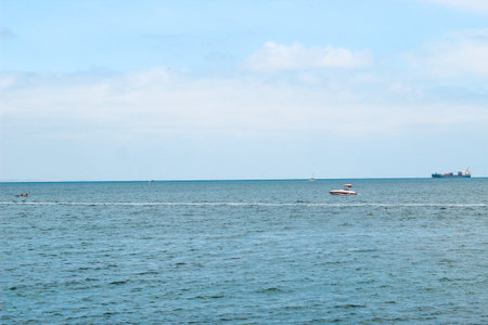 tourist boat sailing here on the blue sea.の写真素材