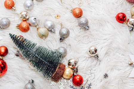 Christmas tree, cones, toys on a fluffy white background.の写真素材