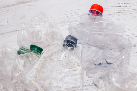 Plastic bottles from sweet water with colorful caps, ecology concept.の写真素材