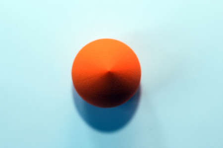 Cosmetic orange sponge sponge for applying makeup.の写真素材