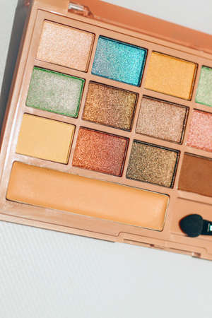 A palette of shimmery eyeshadows in different colors.の写真素材