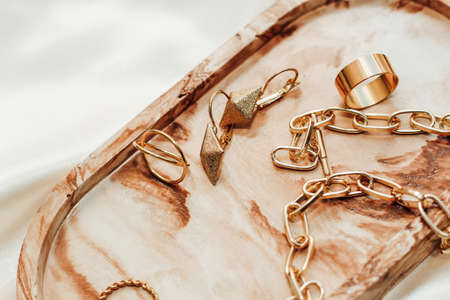 Gypsum marble decorative stand and gold decoration on the background of silk stand.の写真素材