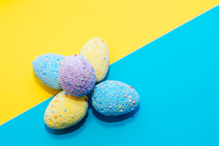 Blue and yellow easter eggs on yellow and blue patriotic background.の写真素材