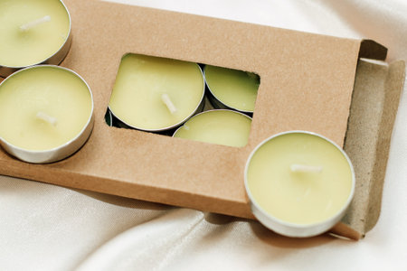 Small decorative aroma candles in craft eco-friendly packaging.の写真素材