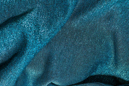 Texture of shiny sparkling lurex fabric blue color.の写真素材