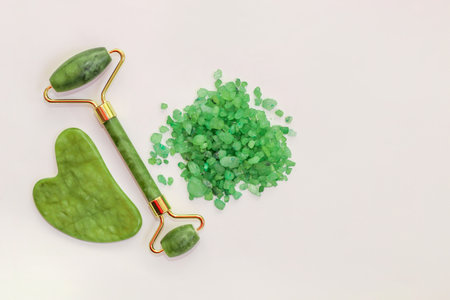 Facial massage jade roller and sea green aroma salt.の写真素材
