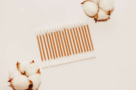 Eco-friendly bamboo cosmetic cotton buds with cotton on a light background.の写真素材