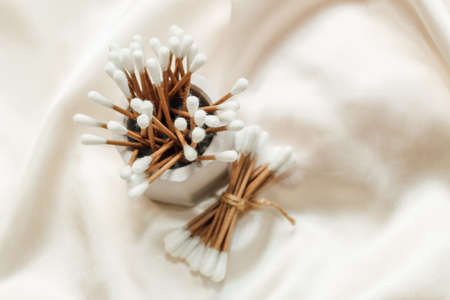 Gypsum marble decorative stand with cosmetic sticks and sponges and cotton.の写真素材