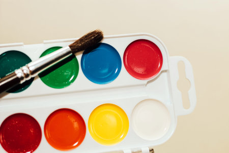 Watercolor children's multicolored paints for drawing with a brush.