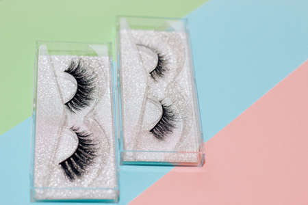 False eyelashes in a box on an abstract paper backgroundの写真素材