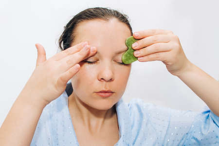 Girl makes a mask for the whole face on problem skin.の写真素材