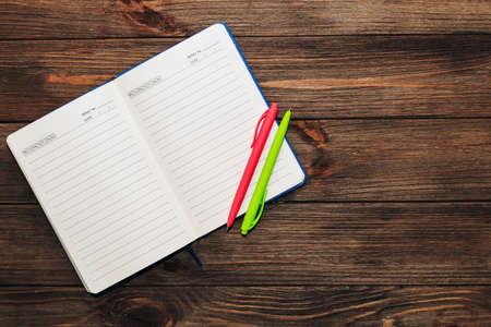 Open notebook diary, lines for writing, convenient time management with space for text.の写真素材