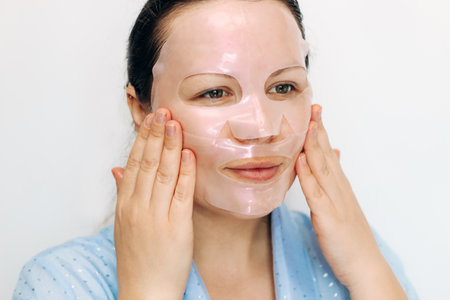 Girl makes a mask for the whole face on problem skin.の写真素材