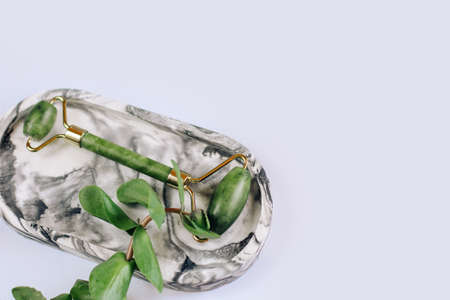 Decorative marble plaster stand and jade massager.の写真素材