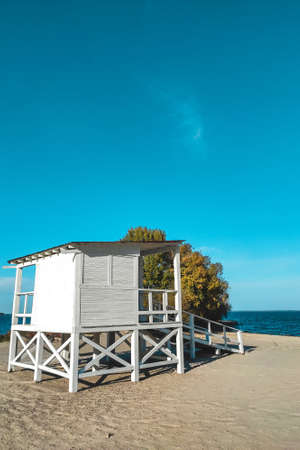White wooden house for lifeguards on the water at the beach.の写真素材