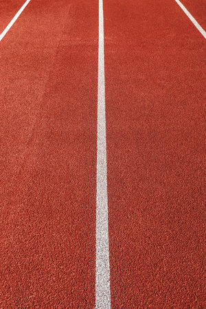 Bicycle treadmill, with white dividing strips, asphalt texture. The concept of the competition.